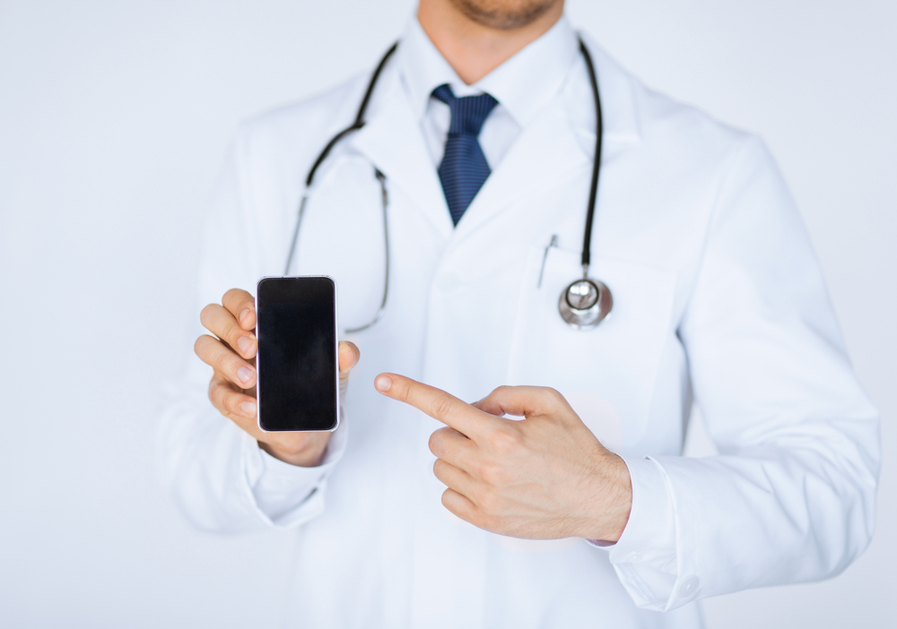 Doctor-holding-mobile-phone