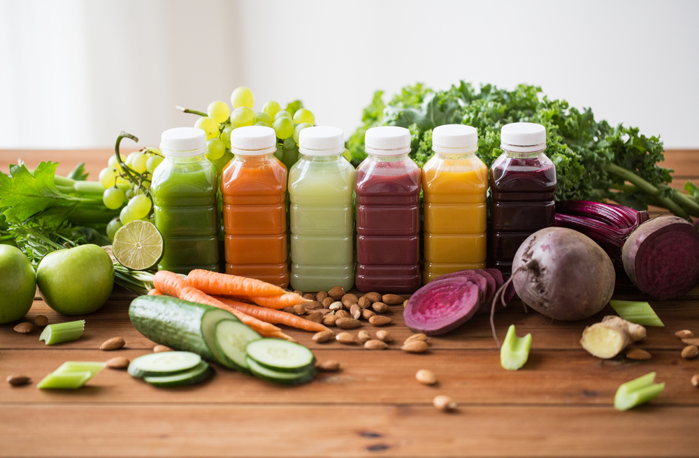 Vegetables-and-juices-on-bench